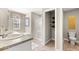 Neutral bathroom featuring a walk-in shower, a double vanity, and toilet at 201 Friendship Oak Way, Hampton, GA 30228