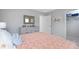 Bedroom featuring a decorative mirror and closet at 201 Friendship Oak Way, Hampton, GA 30228