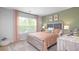 Bedroom with large window providing natural light at 201 Friendship Oak Way, Hampton, GA 30228