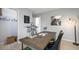 Organized home office featuring a sleek desk, modern light fixture, and adjacent closet space at 201 Friendship Oak Way, Hampton, GA 30228