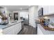 Modern kitchen showcasing granite counters, stainless steel appliances, and ample cabinet space at 201 Friendship Oak Way, Hampton, GA 30228