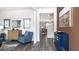 Stylish foyer showcasing wood floors, elegant decor, and an open doorway to the living room at 201 Friendship Oak Way, Hampton, GA 30228