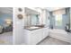 Ensuite bathroom with dual vanity, soaking tub, and separate shower at 201 Friendship Oak Way, Hampton, GA 30228