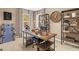 A modern office with a wooden desk, a vintage clock, and ample shelving at 201 Friendship Oak Way, Hampton, GA 30228
