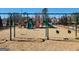 Community playground featuring swing sets and climbing structures surrounded by a safety fence at 201 Friendship Oak Way, Hampton, GA 30228