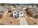 Beautiful aerial view of home featuring manicured lawn, long driveway, and neighborhood at 445 Sawmill Trce, Hampton, GA 30228