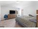 Bedroom with carpet, tv, and window for natural lighting at 445 Sawmill Trce, Hampton, GA 30228