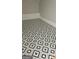 Close-up on designer black and white geometrically patterned tile flooring at 2085 Dellwood Pl, Decatur, GA 30032