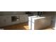 Well-lit kitchen featuring a center island, white cabinets, stainless steel appliances and hardwood floors at 2085 Dellwood Pl, Decatur, GA 30032