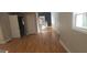 Bright living room with hardwood floors, large windows and a staircase leading to the second floor at 2085 Dellwood Pl, Decatur, GA 30032