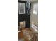 Foyer area featuring a modern staircase with white railings and a stylish chandelier at 2085 Dellwood Pl, Decatur, GA 30032