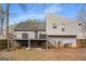 Home exterior with a wooden deck, providing an inviting space for outdoor activities and relaxation at 3747 Junior Ln, Douglasville, GA 30135