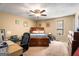 Relaxing bedroom with neutral walls, large bed, ceiling fan and work-from-home station at 3747 Junior Ln, Douglasville, GA 30135