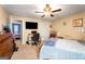 Spacious bedroom with carpet flooring features a desk and dresser, plus an ensuite bath at 3747 Junior Ln, Douglasville, GA 30135