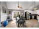 Bright dining area featuring tile flooring, access to the deck, and adjacent kitchen at 3747 Junior Ln, Douglasville, GA 30135