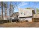 Exterior of the house showcasing a backyard and wooden deck for outdoor enjoyment and relaxation at 3747 Junior Ln, Douglasville, GA 30135