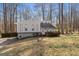 Attractive exterior elevation of a home featuring well-maintained landscaping and mature trees at 3747 Junior Ln, Douglasville, GA 30135