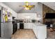 Kitchen with stainless steel appliances, white cabinetry and vaulted ceilings at 3747 Junior Ln, Douglasville, GA 30135