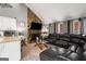 Cozy living room with stone fireplace, vaulted ceilings, and a comfortable seating arrangement at 3747 Junior Ln, Douglasville, GA 30135