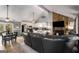 Open living room and kitchen featuring a stone fireplace, vaulted ceilings, and dining area at 3747 Junior Ln, Douglasville, GA 30135