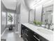 Contemporary bathroom with double vanity, sleek black cabinets, and plenty of natural light plus designer touches at 305 Worthing Lane, Mcdonough, GA 30253