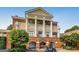 Stately clubhouse featuring brick archways, columned facade and outdoor seating at 305 Worthing Lane, Mcdonough, GA 30253