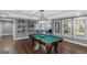 Spacious game room featuring a pool table and great light at 305 Worthing Lane, Mcdonough, GA 30253