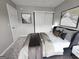 Stylishly staged bedroom featuring a bed, large closet, and modern decor at 102 Ellis Dr, Conyers, GA 30012