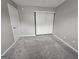 Carpeted bedroom with painted walls and a closet at 102 Ellis Dr, Conyers, GA 30012