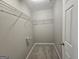 Walk-in closet featuring shelving and carpeted flooring at 102 Ellis Dr, Conyers, GA 30012