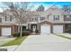 Charming townhome with a brick facade, attached garage, and well-maintained landscaping at 102 Ellis Dr, Conyers, GA 30012