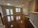 Spacious living room with hardwood floors, large windows, and access to the backyard at 102 Ellis Dr, Conyers, GA 30012