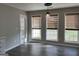 Cozy dining area with lots of light, hardwood floors and modern pendant lighting at 328 Cattlemans Cir, Mcdonough, GA 30252