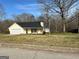 Front of the house with its siding and paved driveway at 328 Cattlemans Cir, Mcdonough, GA 30252
