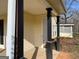 Inviting front porch with black column posts and yellow siding at 328 Cattlemans Cir, Mcdonough, GA 30252