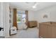 Bright Bedroom with neutral walls, a window view, and wood furniture at 117 Everhill, Peachtree City, GA 30269