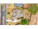 Aerial view of a home showcasing its roof, backyard with a patio, and surrounding greenery at 2510 Shoreline Pkwy, Villa Rica, GA 30180