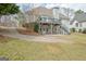 Backyard with raised deck, covered patio and stairs to upper deck from patio at 2510 Shoreline Pkwy, Villa Rica, GA 30180