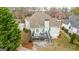 Aerial view of the home's backyard showcasing a deck, patio, lush greenery and private setting at 2510 Shoreline Pkwy, Villa Rica, GA 30180
