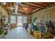 Unfinished basement with concrete floor and exposed wooden ceiling, potential for customization at 2510 Shoreline Pkwy, Villa Rica, GA 30180