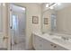 Bright bathroom with a double vanity, large mirror, and a shower and tub combination at 2510 Shoreline Pkwy, Villa Rica, GA 30180