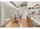 Bright breakfast nook features shuttered windows, hardwood floors, and a breakfast table with seating for four at 2510 Shoreline Pkwy, Villa Rica, GA 30180