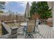 Outdoor deck with table, chairs, umbrella, and grills, great view of backyard and trees at 2510 Shoreline Pkwy, Villa Rica, GA 30180
