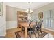 Traditional dining room with hardwood floors, chandelier, and hutch at 2510 Shoreline Pkwy, Villa Rica, GA 30180