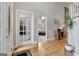 Spacious foyer featuring hardwood floors, views to the office and stairway at 2510 Shoreline Pkwy, Villa Rica, GA 30180