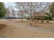 Scenic view of a gazebo and walking path leading to a tennis court in a quiet community at 2510 Shoreline Pkwy, Villa Rica, GA 30180