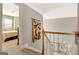 Upstairs hallway with view into bedroom and features a neutral color palette at 2510 Shoreline Pkwy, Villa Rica, GA 30180