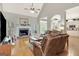 Open living room with wood floors, a fireplace, and large leather chairs for relaxed seating at 2510 Shoreline Pkwy, Villa Rica, GA 30180