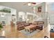 Spacious living room featuring hardwood floors, stairs, and views into the kitchen and dining areas at 2510 Shoreline Pkwy, Villa Rica, GA 30180