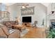 Cozy living room boasting a fireplace, hardwood floors, and comfortable seating, perfect for relaxation at 2510 Shoreline Pkwy, Villa Rica, GA 30180
